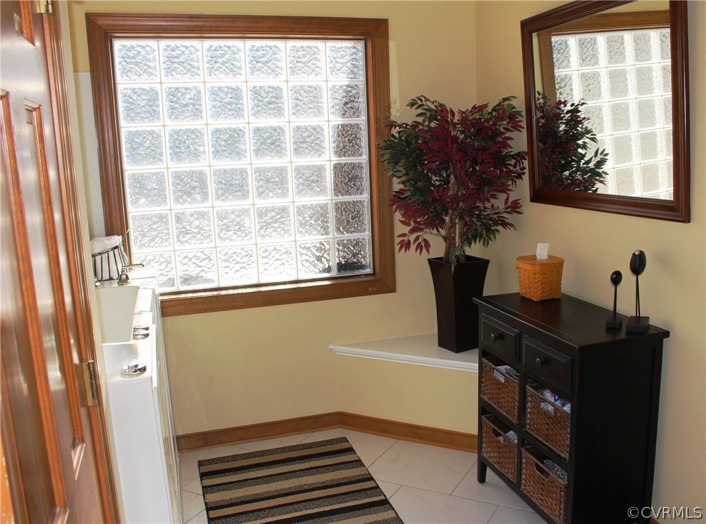 6501 Moseley Road Moseley, VA 23120 - Photo 18 of 27 a room with window and potted plant on a shelf