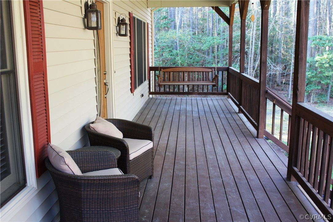 6501 Moseley Road Moseley, VA 23120 - Photo 3 of 27 a balcony with wooden floor