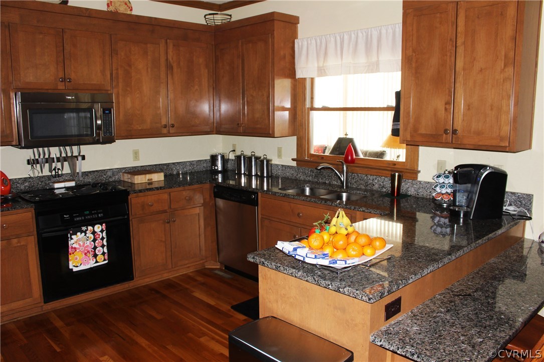 6501 Moseley Road Moseley, VA 23120 - Photo 7 of 27 a kitchen with stainless steel appliances granite countertop a stove a sink and a microwave