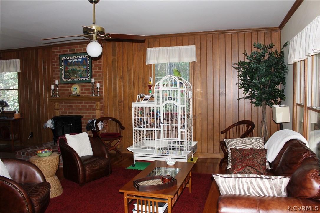 6501 Moseley Road Moseley, VA 23120 - Photo 9 of 27 a living room with furniture fireplace and a large window