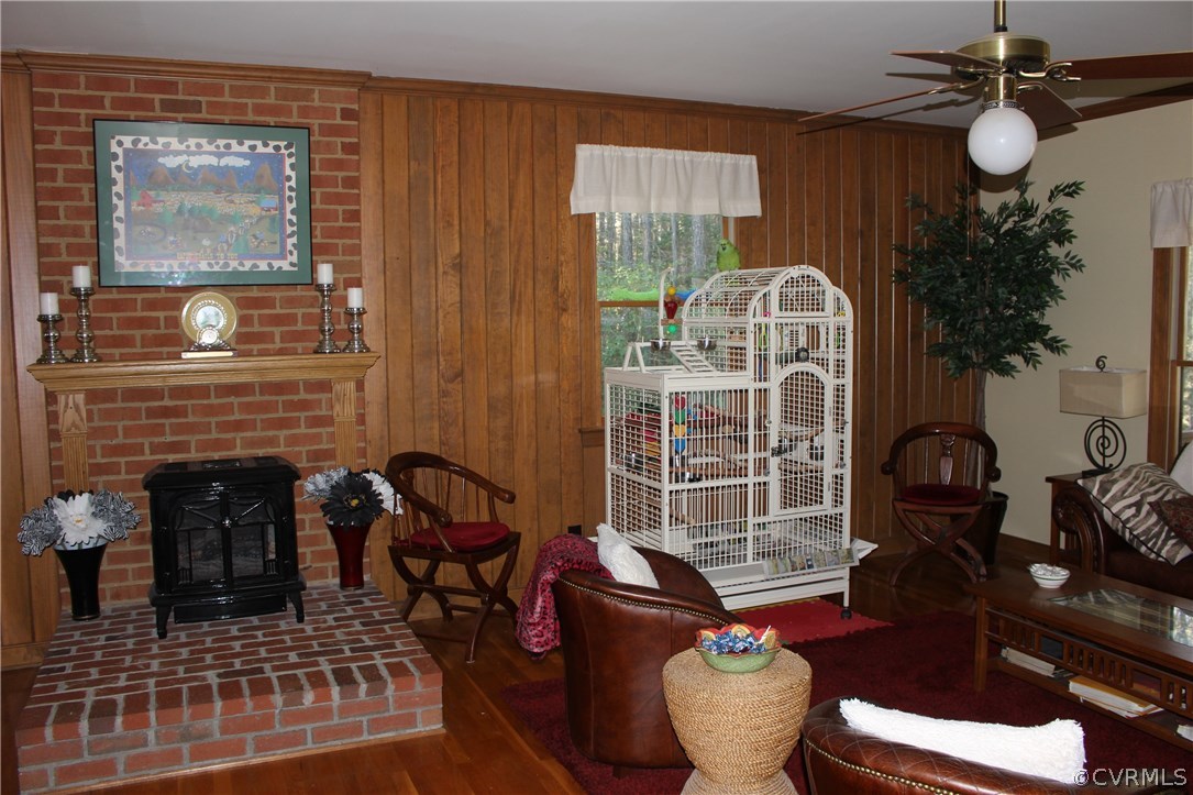 6501 Moseley Road Moseley, VA 23120 - Photo 10 of 27 a living room with furniture and a fireplace