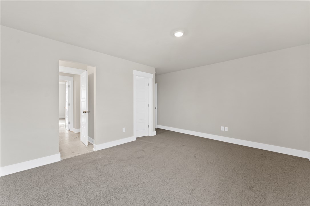 167 Tiger Lily Drive Anderson, SC 29621 - Photo 28 of 34 A spacious, naturally illuminated room featuring plush carpeting and pristine neutral walls awaits your personal touch.