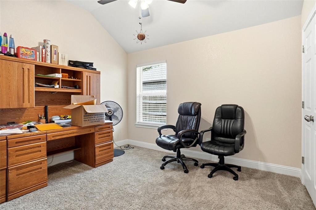 904 Avagail Avenue Springtown, TX 76082 - Photo 22 of 27 a view of a workspace with furniture and a window
