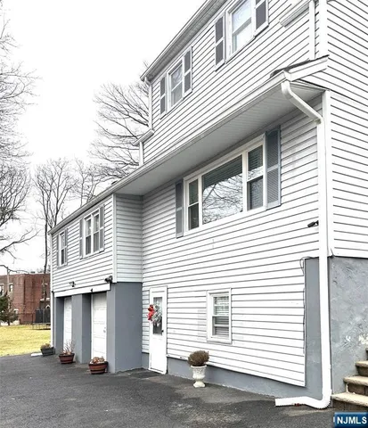 a view of a house with a garage
