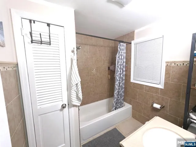 a bathroom with a toilet and a bathtub