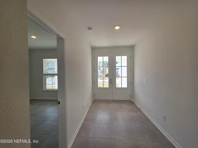 a bathroom with a sink and mirror with toilet