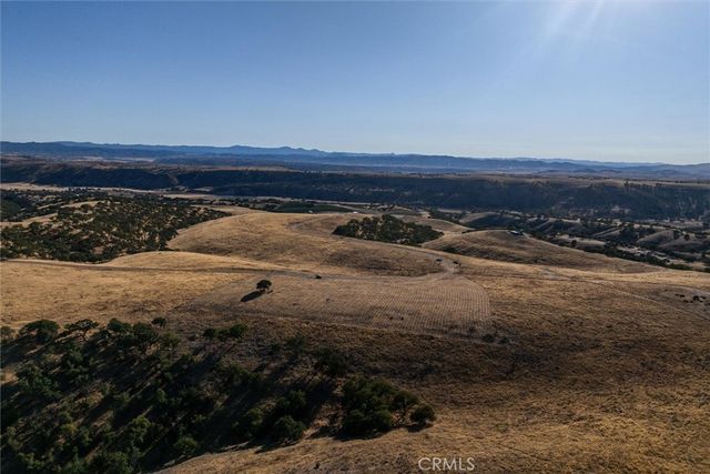 a view of an ocean beach and mountain
