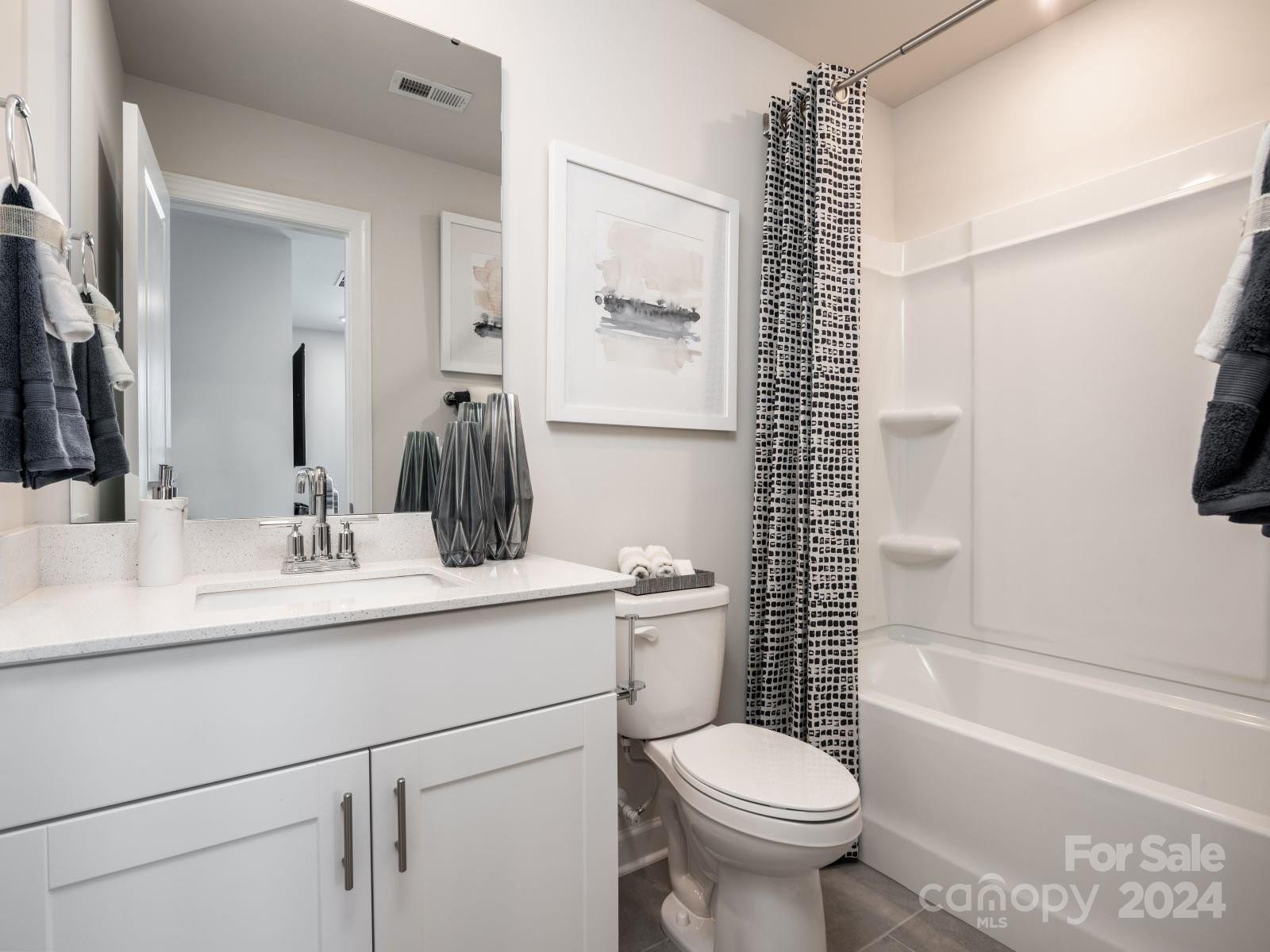 823 Windage Way Pineville, NC 28134 - Photo 9 of 15 a bathroom with a sink toilet tub and shower