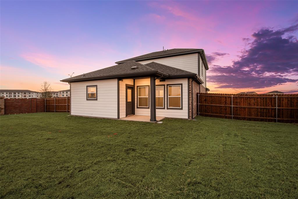 261 Sutter Mill Road Saginaw, TX 76131 - Photo 23 of 24 a view of a house with backyard and garden