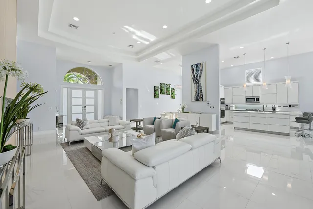 a living room with furniture a fireplace and a table