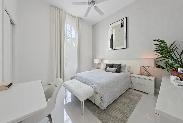 an aerial view of a house with a yard and lake view