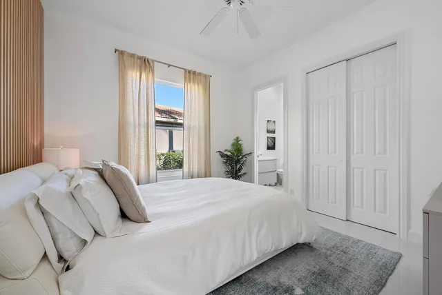 an aerial view of residential houses with outdoor space and lake view
