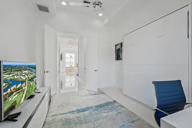 an aerial view of a house with a lake view