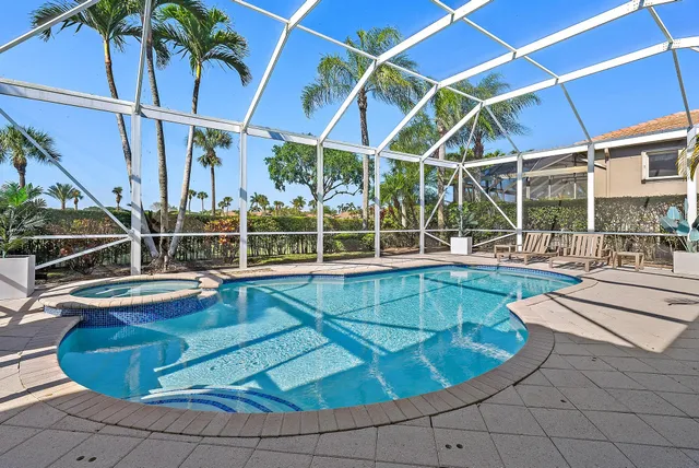 an aerial view of residential houses with outdoor space and street view