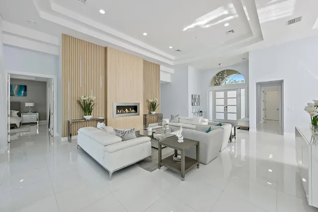 a living room with furniture and a lamp