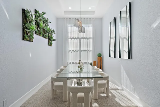 a kitchen with sink cabinets and living room view