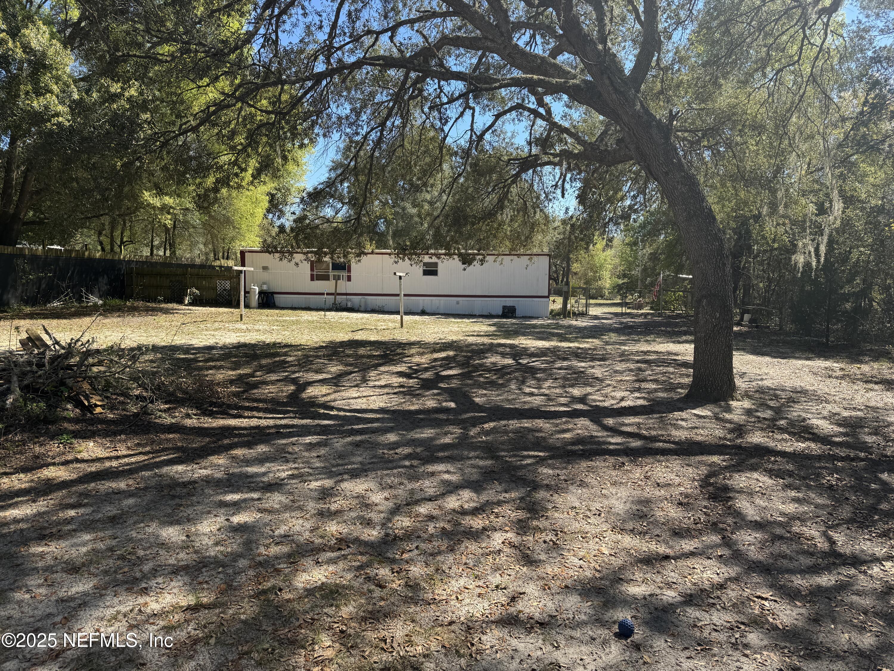 208 Lakeview Road Melrose, FL 32666 - Photo 21 of 22 a view of a yard with large trees