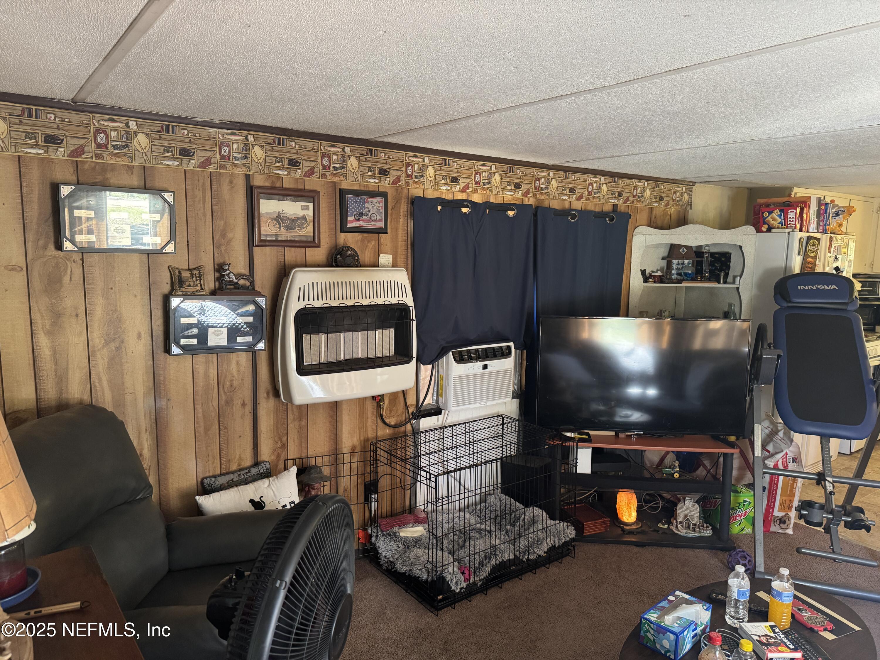 208 Lakeview Road Melrose, FL 32666 - Photo 6 of 22 a living room with furniture and a flat screen tv