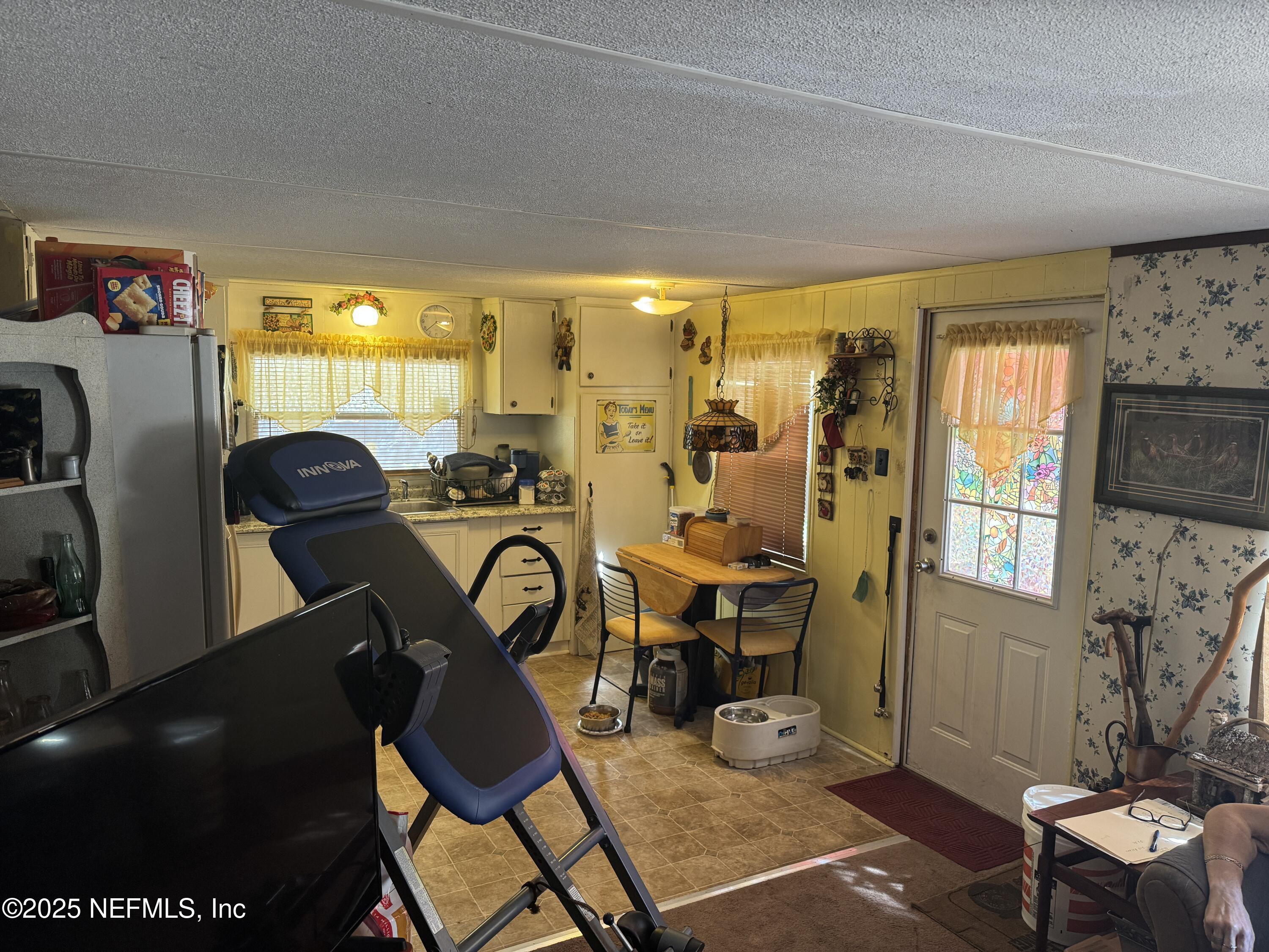 208 Lakeview Road Melrose, FL 32666 - Photo 7 of 22 a view of a room with gym equipment