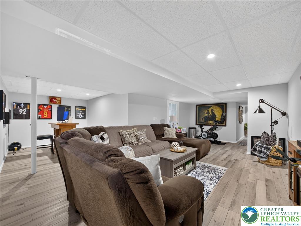 4148 Ross Road Bethlehem, PA 18020 - Photo 65 of 67 A generously proportioned finished basement offers versatile living space with light-toned flooring.