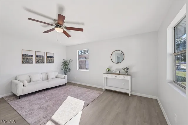 a living room with furniture and a window