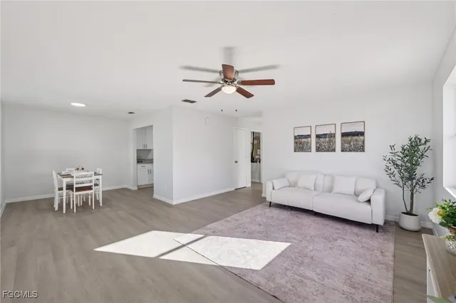 a living room with furniture and a table