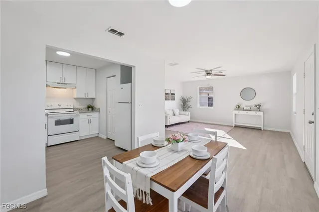 a open kitchen with a table and chairs in it