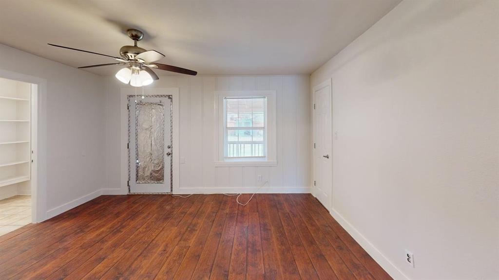 2246 Anson Road Dallas, TX 75235 - Photo 11 of 20 wooden floor in an empty room with a window