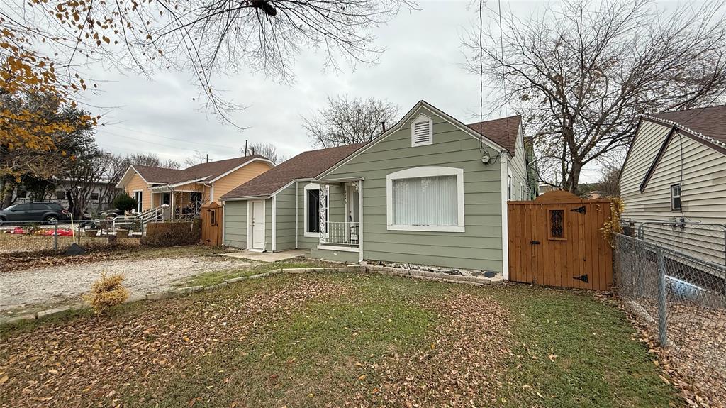 2246 Anson Road Dallas, TX 75235 - Photo 3 of 20 a front view of a house with a yard