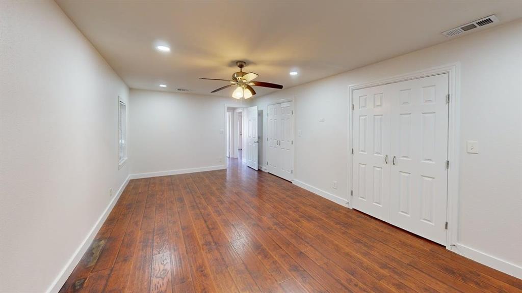 2246 Anson Road Dallas, TX 75235 - Photo 10 of 20 wooden floor in an empty room with a window