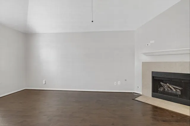 an empty room with a fireplace