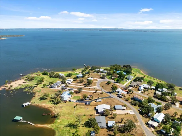 an aerial view of a house with a ocean view