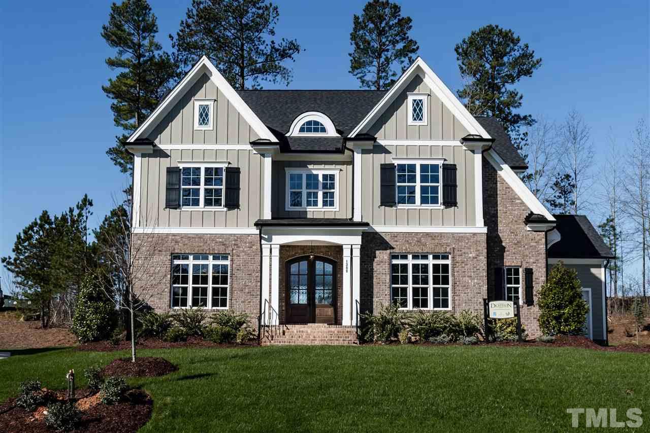 12309 Kyle Abbey Lane, Unit 2 Raleigh, NC 27613 - Photo 1 of 1 front view of a house with a yard