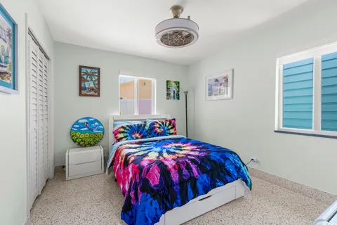 a utility room with a stove and a sink