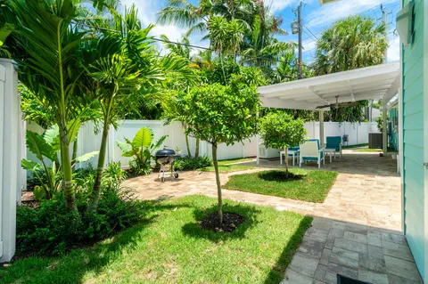 view of a hallway with two white cabinets