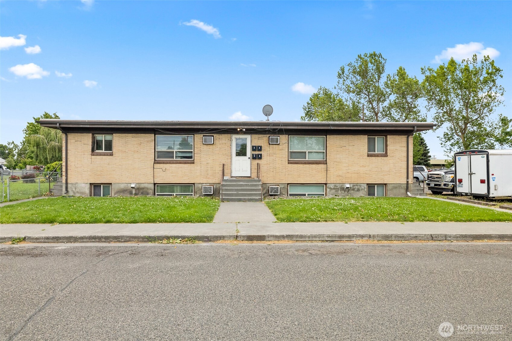 1304 West Hopkins Street Pasco, WA 99301 - Photo 1 of 12 a view of street along with road and trees
