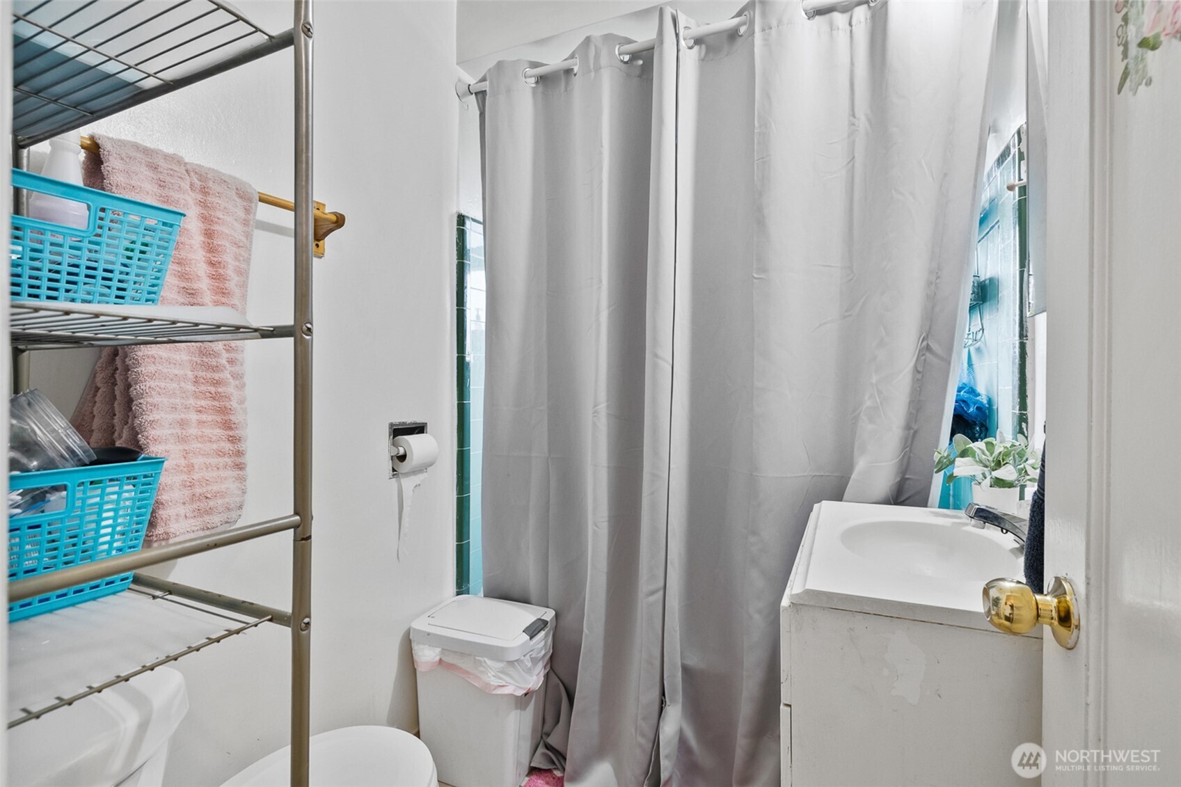 1304 West Hopkins Street Pasco, WA 99301 - Photo 11 of 12 a bathroom with a sink and toilet