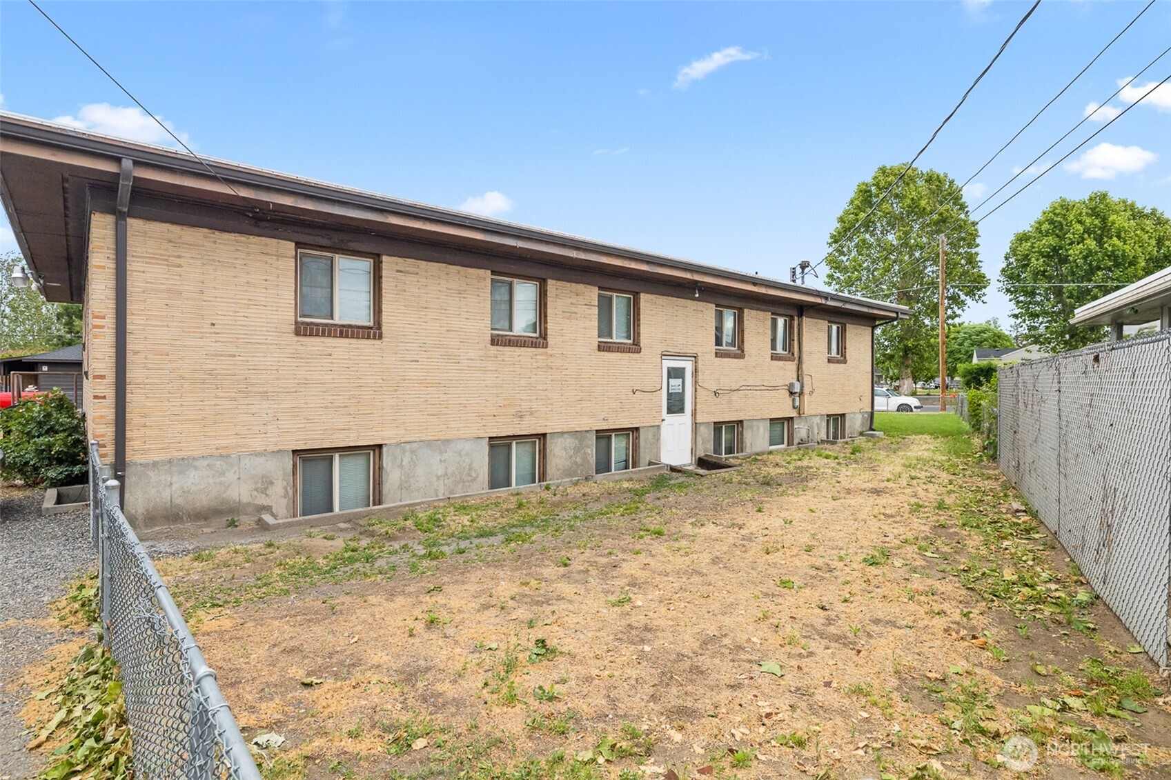 1304 West Hopkins Street Pasco, WA 99301 - Photo 5 of 12 a house view with a backyard space