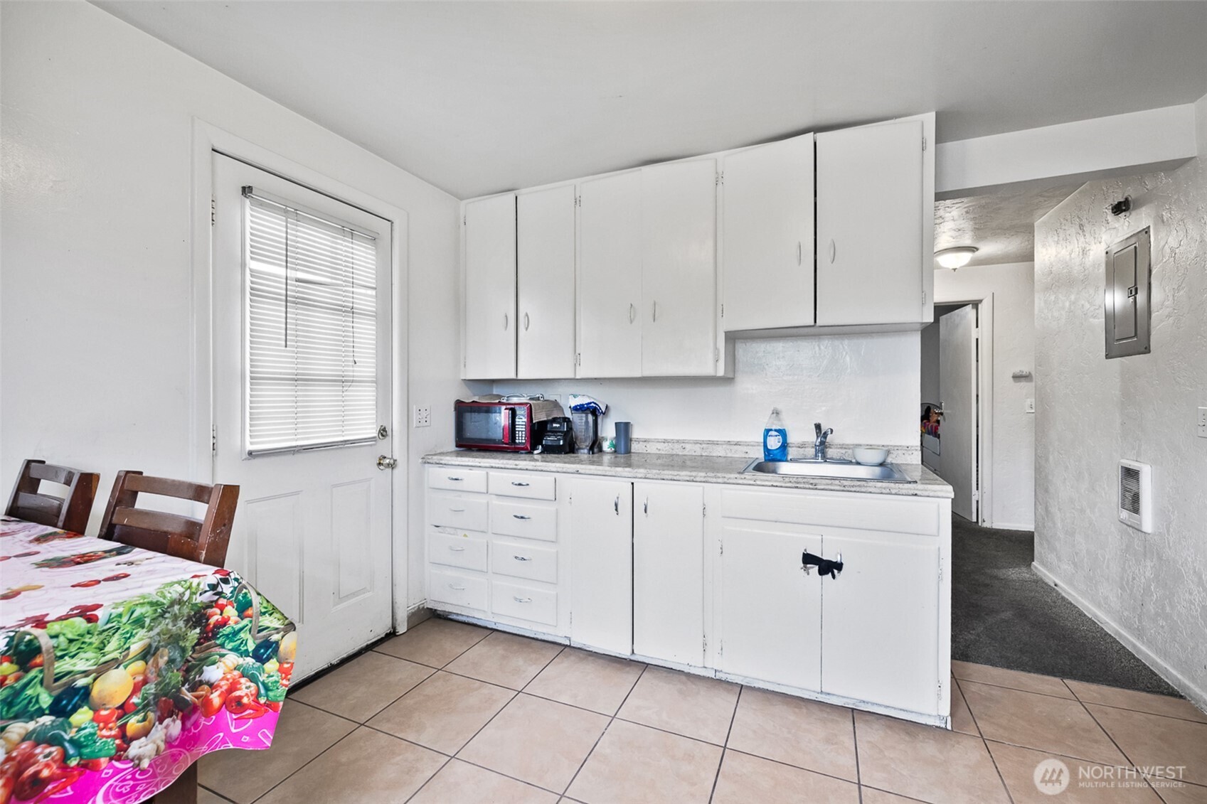 1304 West Hopkins Street Pasco, WA 99301 - Photo 7 of 12 a kitchen with granite countertop a white stove top oven and cabinets