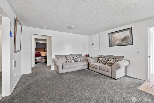 a bed sitting in a bedroom next to a wooden door