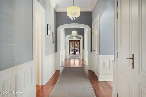 a view of a hallway with a chandelier
