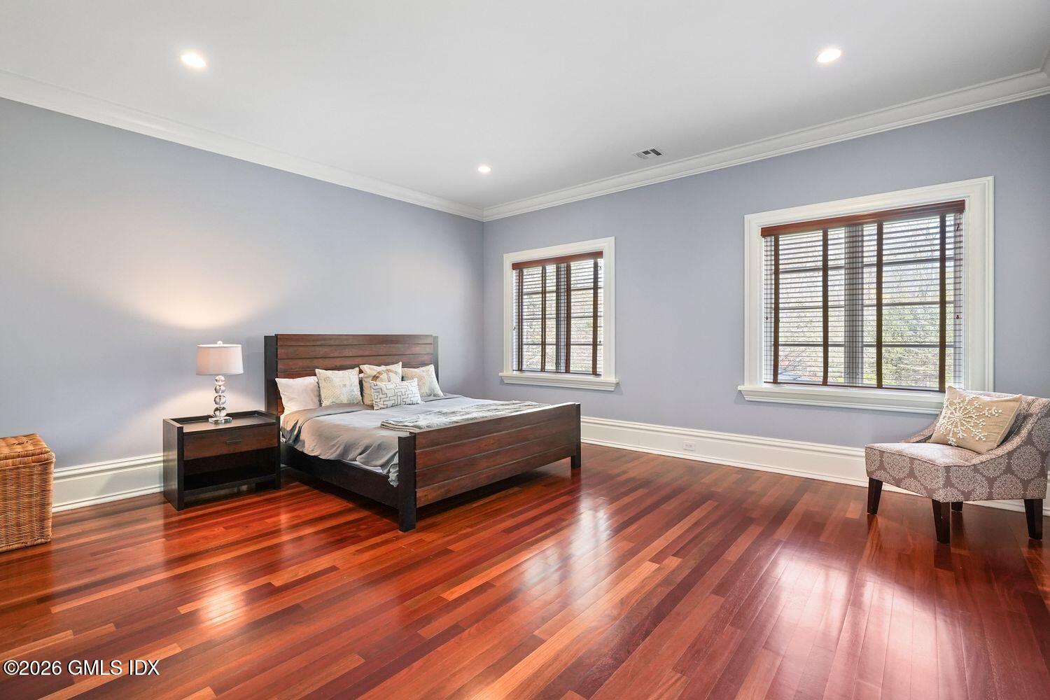 44 Hunting Ridge Road Greenwich, CT 06831 - Photo 18 of 30 a spacious bedroom with a bed and wooden floor