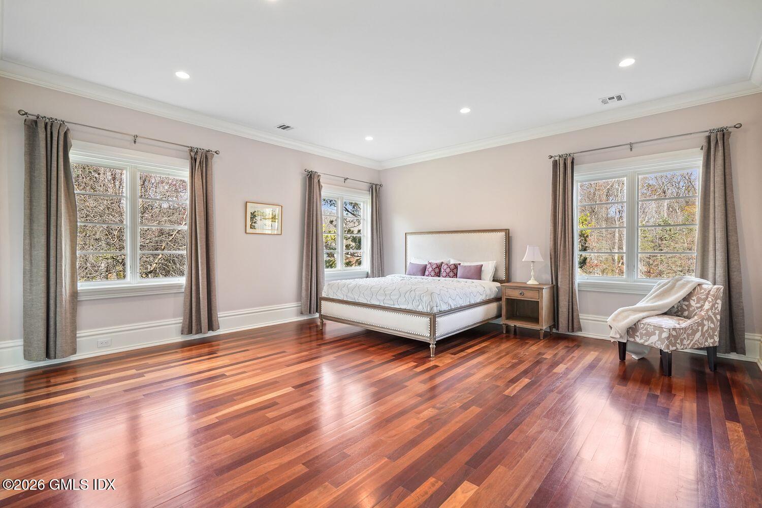 44 Hunting Ridge Road Greenwich, CT 06831 - Photo 19 of 30 a bedroom with a bed and wooden floor