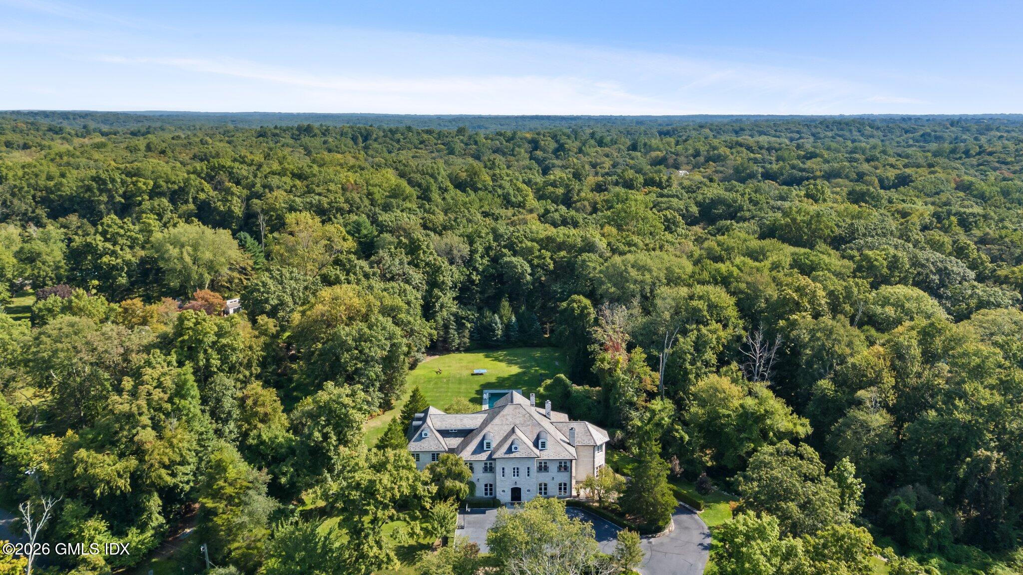 44 Hunting Ridge Road Greenwich, CT 06831 - Photo 2 of 30 an aerial view of a house with a yard