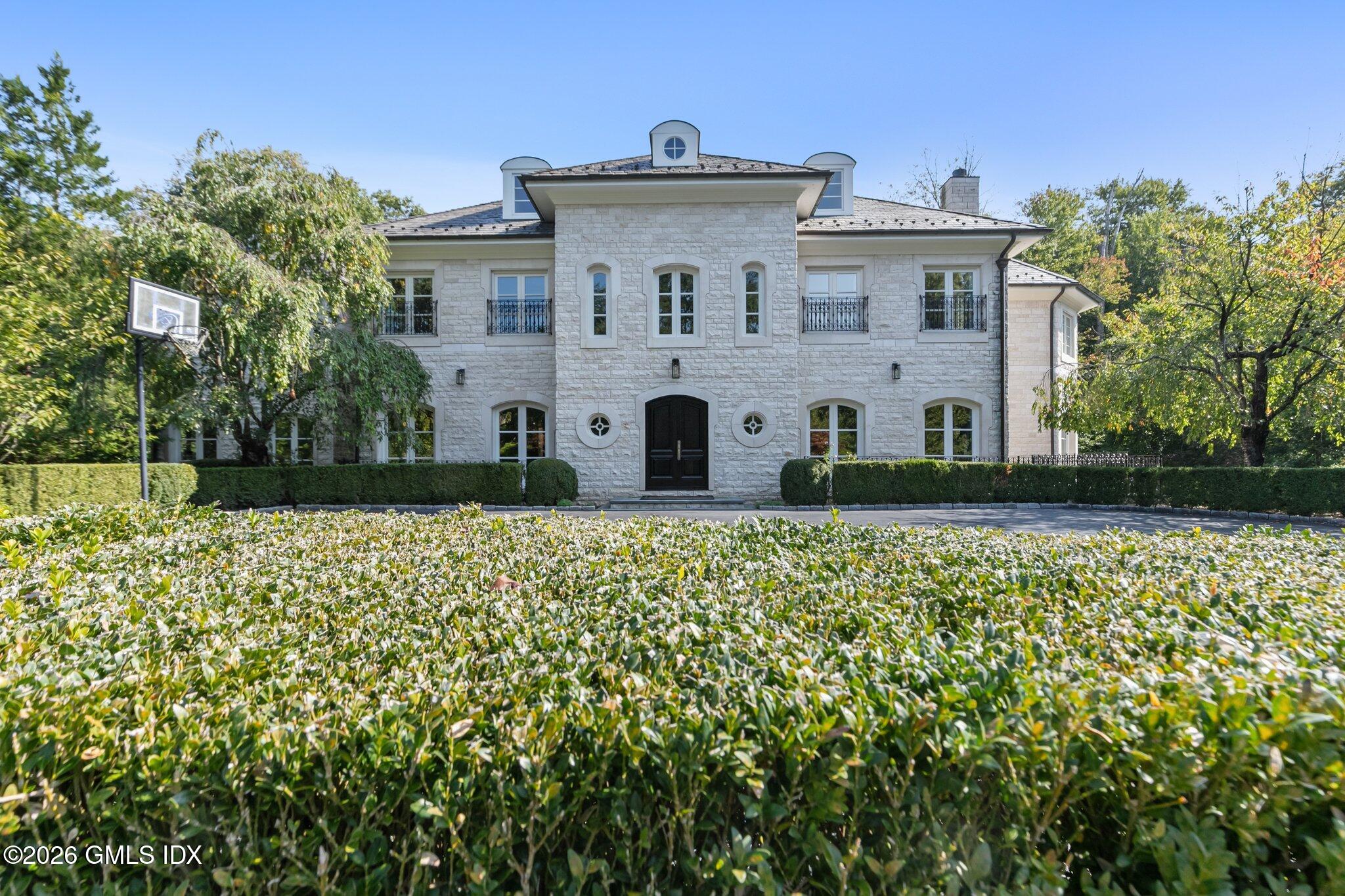 44 Hunting Ridge Road Greenwich, CT 06831 - Photo 4 of 30 front view of a house with a yard