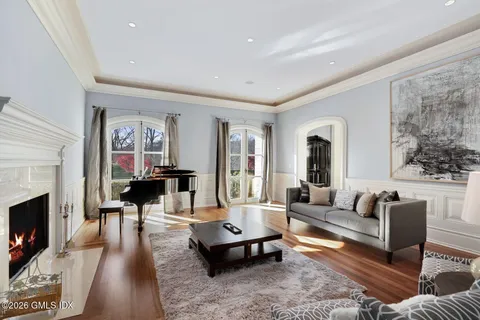 a living room with furniture and a fireplace