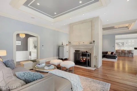 a bedroom with furniture and a fireplace