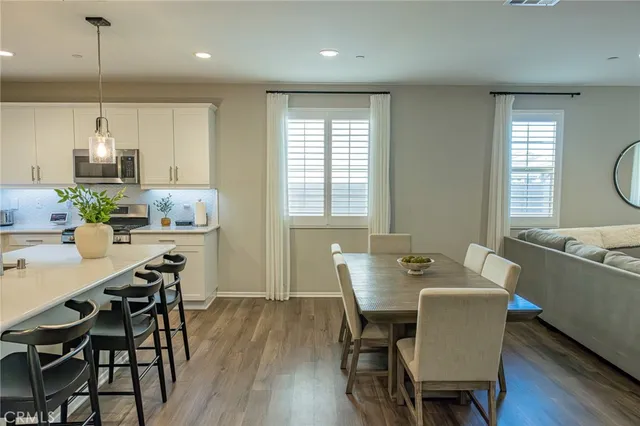 a dining room with furniture and window