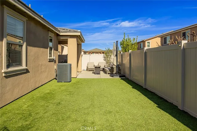 a view of a back yard of the house