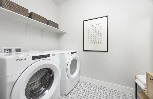 a view of a hallway with washer and dryer